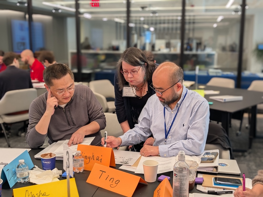 Faculty at the FTI working on an activity